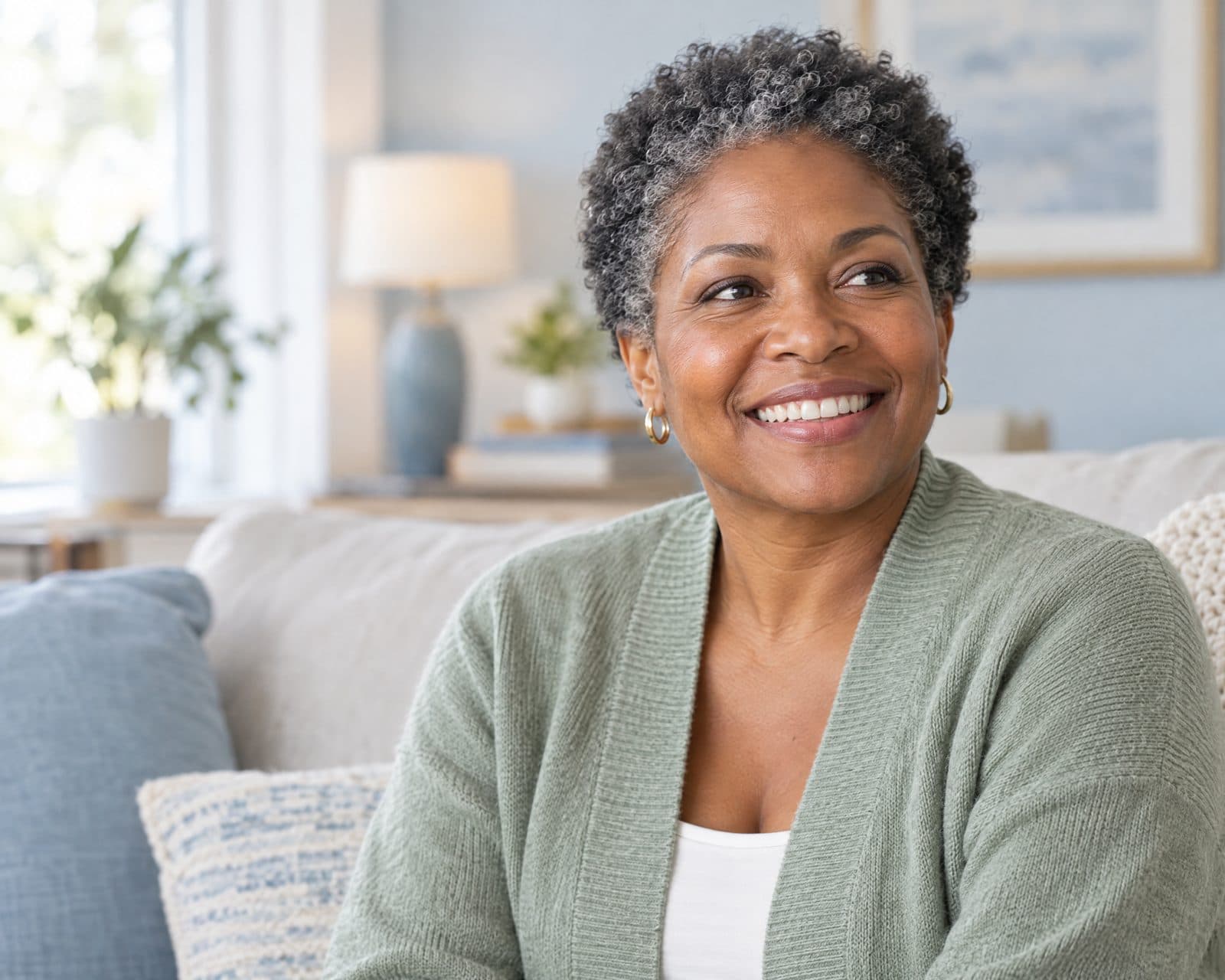 Illustrative portrait of an adult smiling on a sofa at home